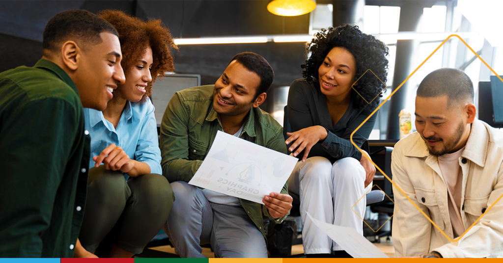 A photo of a diverse team working together seamlessly. To highlight Microsoft 365's seamless collaboration benefit