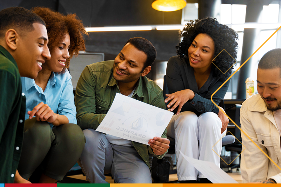 A photo of a diverse team working together seamlessly. To highlight Microsoft 365's seamless collaboration benefit